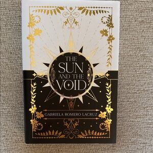 The Sun and The Void Book with Gold and Black Cover
